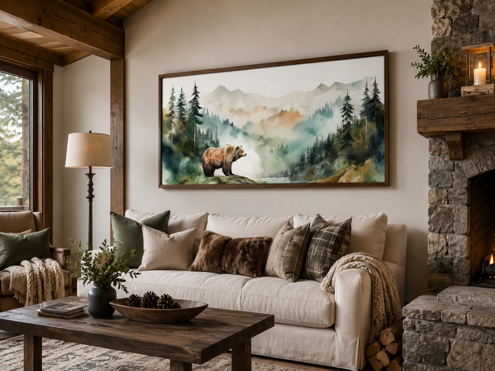 Bear in the wilderness forest watercolor framed canvas wall art hanging above a white sofa.