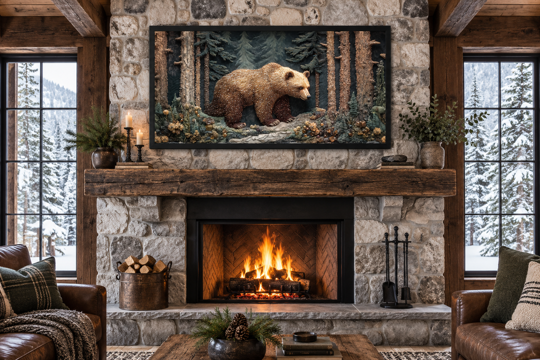 Framed bear tapestry wall art above a stone fireplace in a rustic cabin living room.