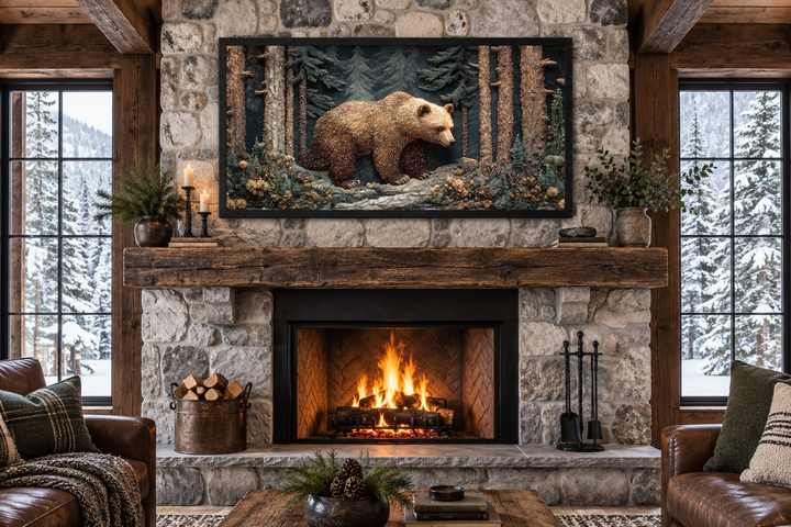 Framed bear tapestry wall art above a stone fireplace in a rustic cabin living room.