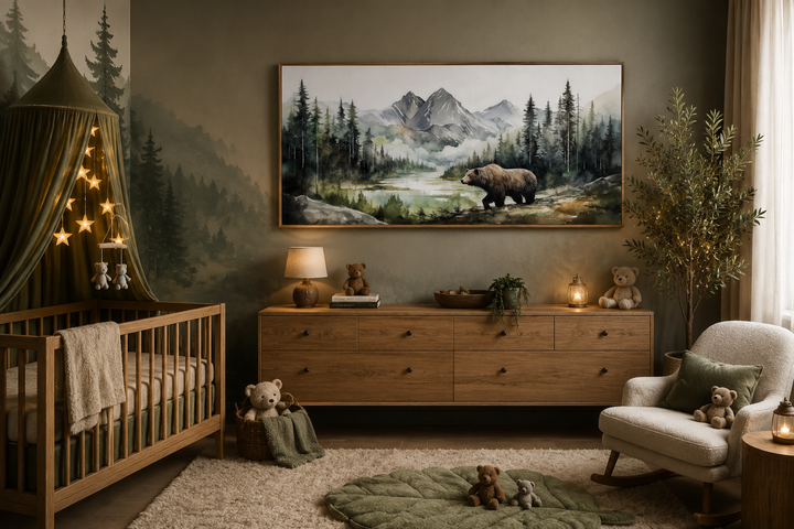 Large watercolor canvas of a bear in a mountain forest, framed above a dresser in a rustic nursery.
