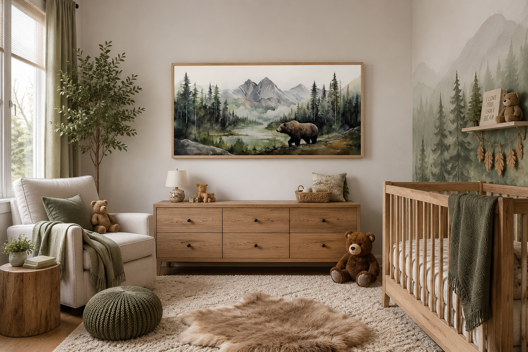Large framed watercolor painting of a bear in a mountain forest hanging in a rustic nursery.