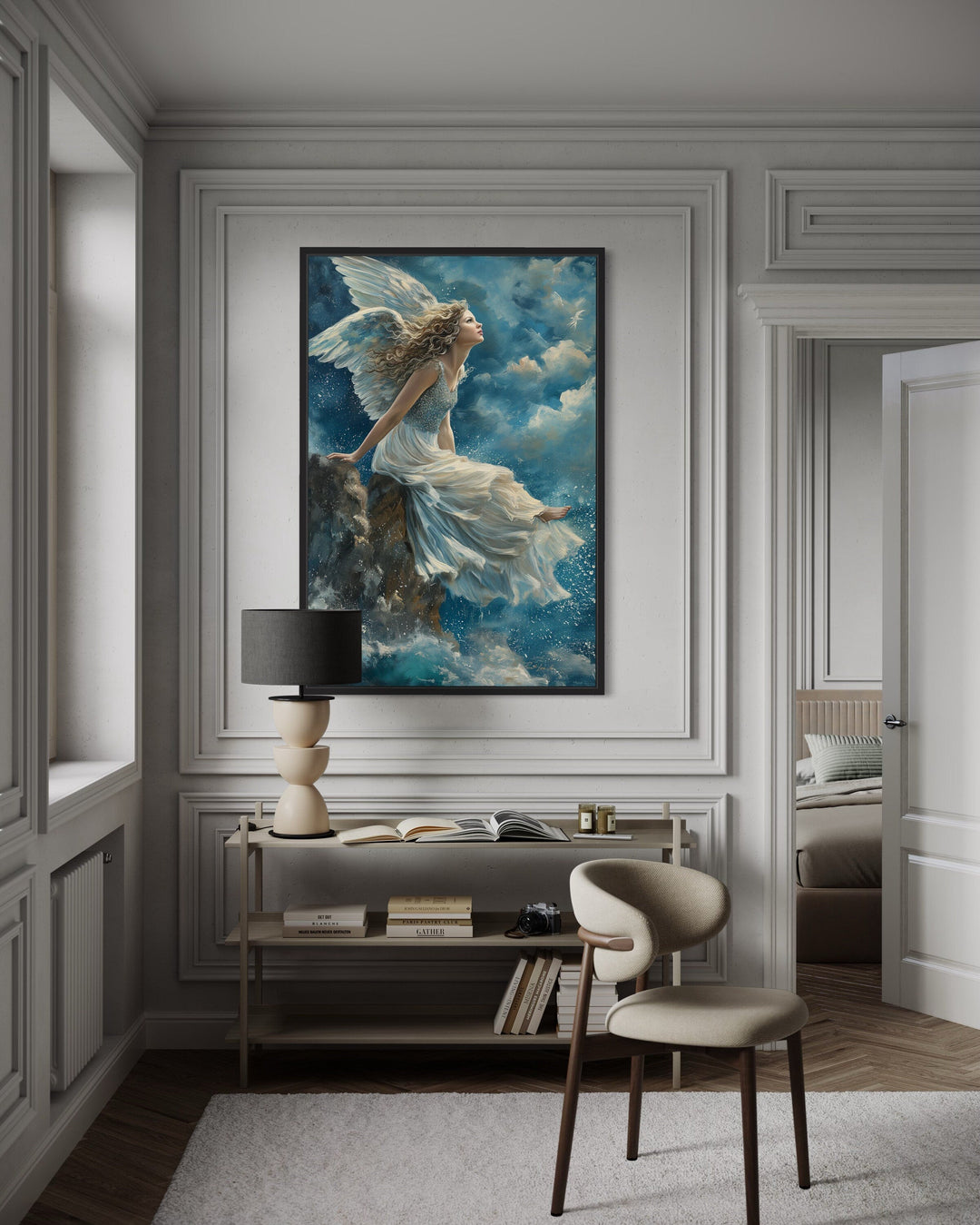 Framed Christian wall art of an angel in a white dress sitting on a mountain among blue clouds.