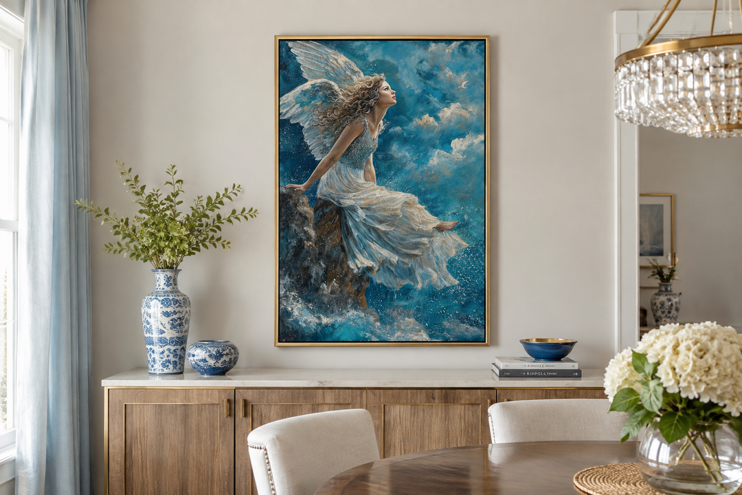 Framed Christian wall art of an angel in a white dress sitting on a mountain among blue clouds.