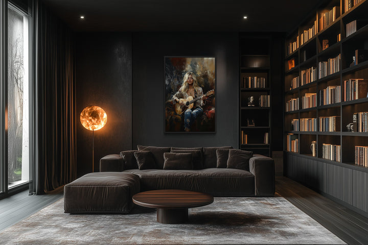 Framed canvas wall art of a blonde girl playing guitar in a dark, modern living room with a library.