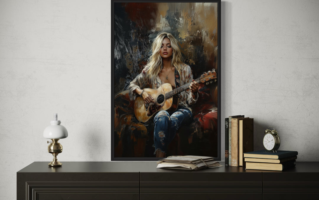 Framed canvas wall art of a blonde girl playing an acoustic guitar in an impressionist style.