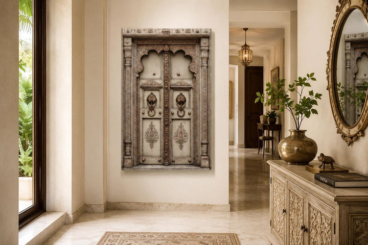 Beige Gold Indian Door Canvas Wall Art featuring ornate carvings and brass handles in a hallway.