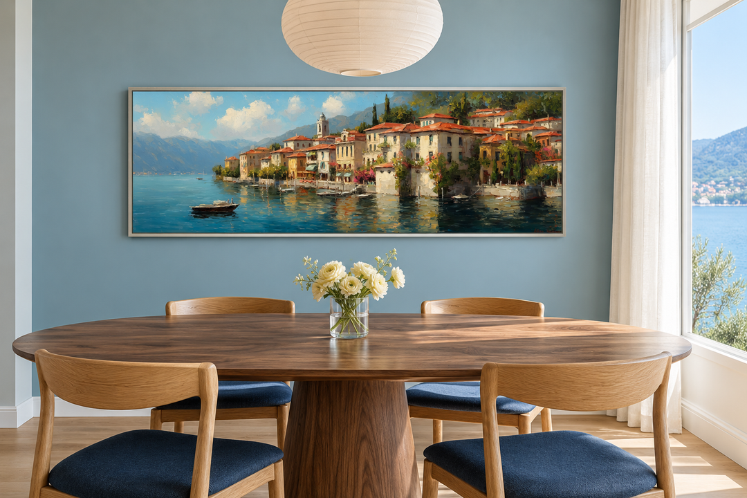 Bellagio Lake Como framed canvas wall art above a dining table with blue chairs and white flowers.