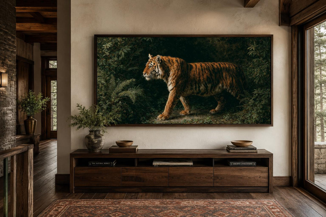 Bengal tiger canvas print in a dark wood frame above a console table in a rustic living room.