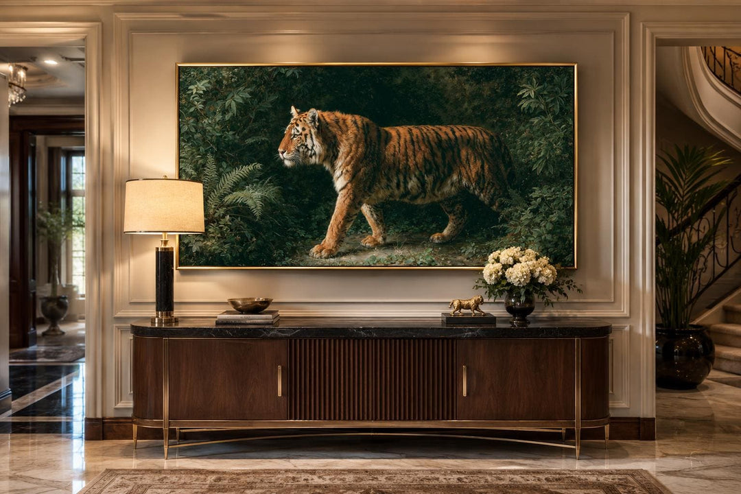 Bengal tiger canvas print in a gold frame above a dark wood sideboard in a formal living room.