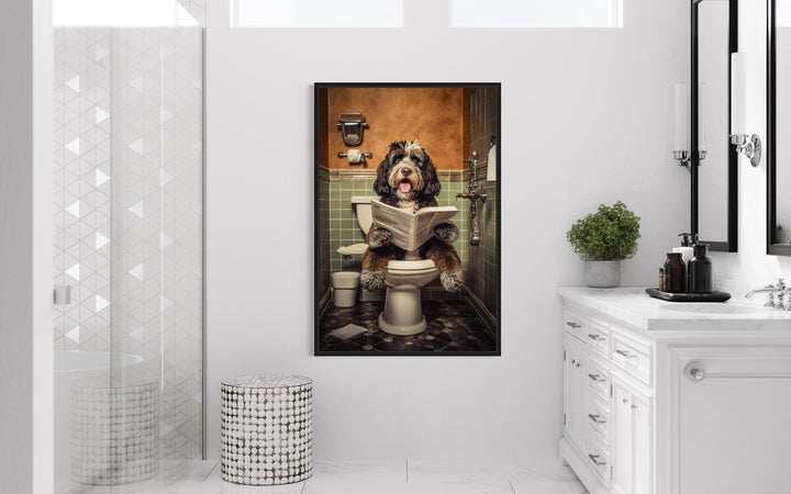 Bernedoodle dog reading a newspaper on a toilet framed canvas wall art in a modern white bathroom.