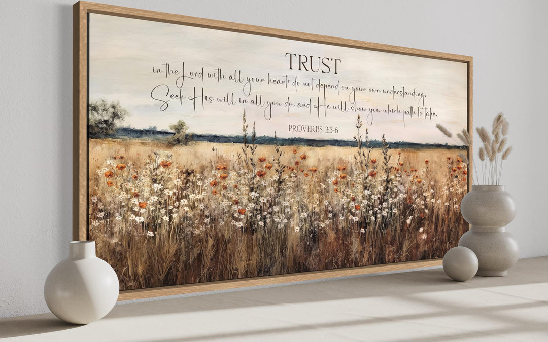 Framed canvas wall art of a golden wildflower field with the scripture Proverbs 3:5-6.