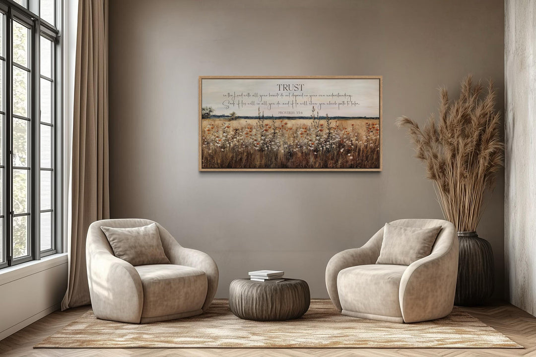 Bible Verse wall art featuring Proverbs 3:5 over a golden wildflower field in a neutral room.