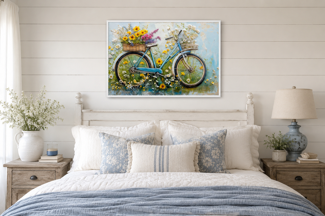 Floral bicycle rustic farmhouse framed canvas wall art hanging above a bed in a cozy bedroom.