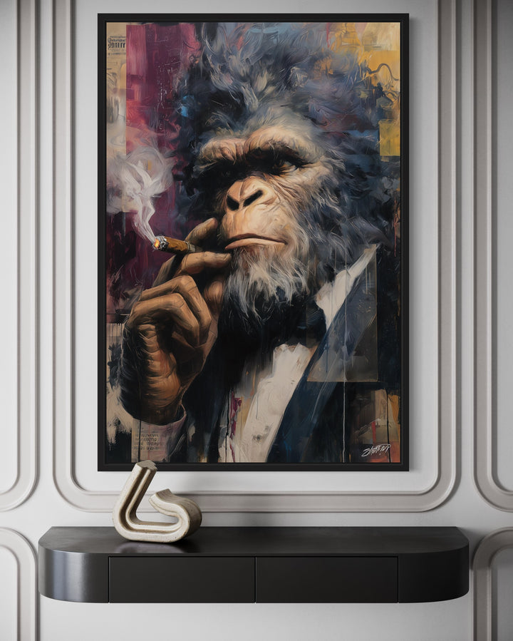 Bigfoot smoking a cigar in a suit, framed canvas wall art above a black console table.