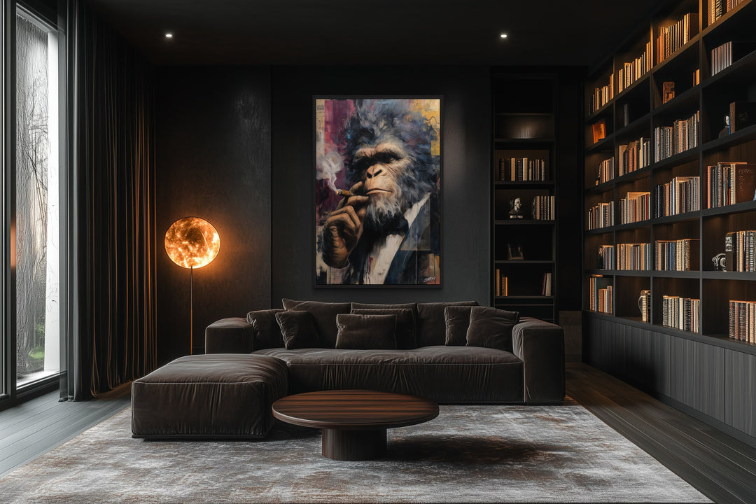 Bigfoot smoking cigar framed canvas wall art in a dark, modern office with a sofa and bookshelves.