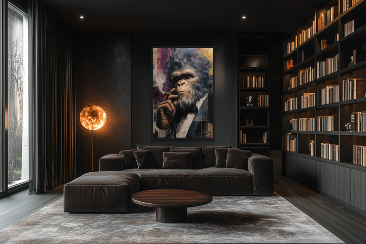 Bigfoot smoking cigar framed canvas wall art in a dark, modern office with a sofa and bookshelves.