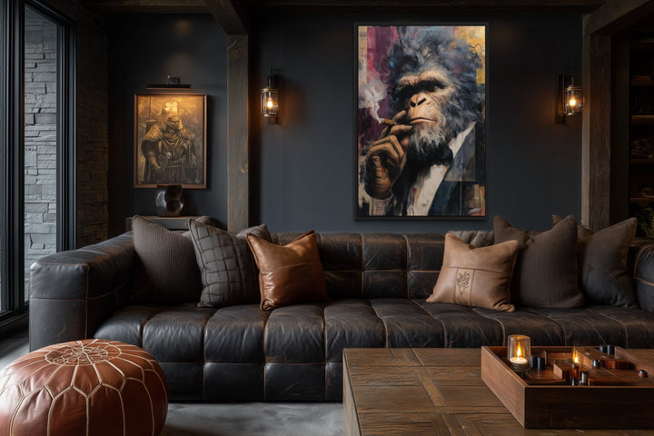 Bigfoot smoking a cigar framed canvas wall art in a dark, masculine lounge with a leather sofa.
