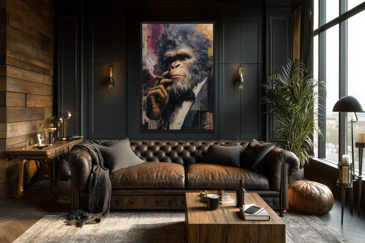 Bigfoot smoking a cigar framed canvas wall art in a dark, sophisticated office with a leather sofa.