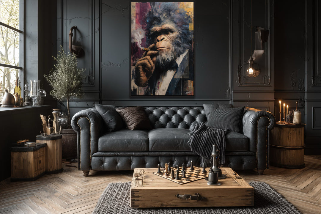 Bigfoot smoking a cigar framed canvas wall art in a dark, sophisticated lounge with a leather sofa.