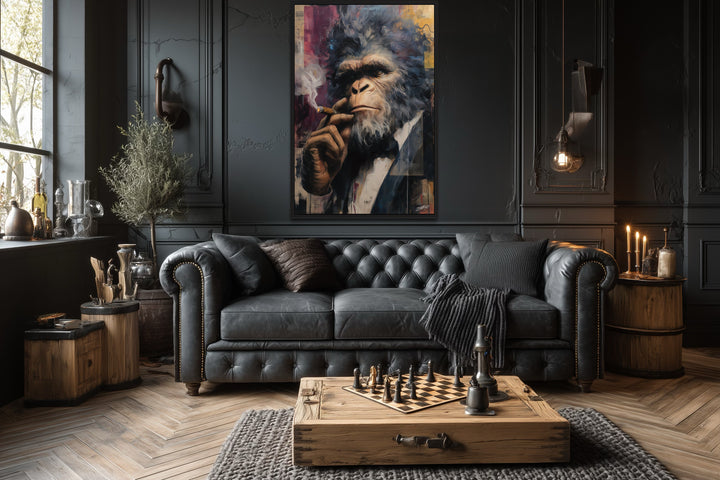 Bigfoot smoking a cigar framed canvas wall art in a dark, sophisticated lounge with a leather sofa.