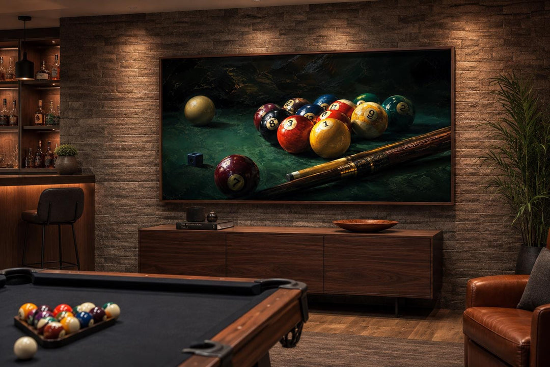 Billiard balls canvas print on a stone wall above a wooden console in a modern game room.