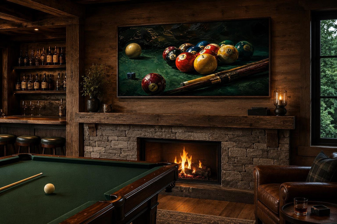 Billiard balls canvas print above a fireplace in a rustic game room with a pool table and bar.