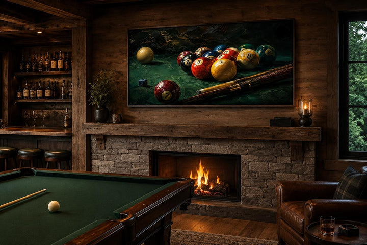 Billiard balls canvas print above a fireplace in a rustic game room with a pool table and bar.