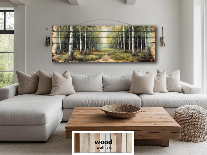 A panoramic birch forest scene printed on horizontal wood planks hangs above a neutral sofa.