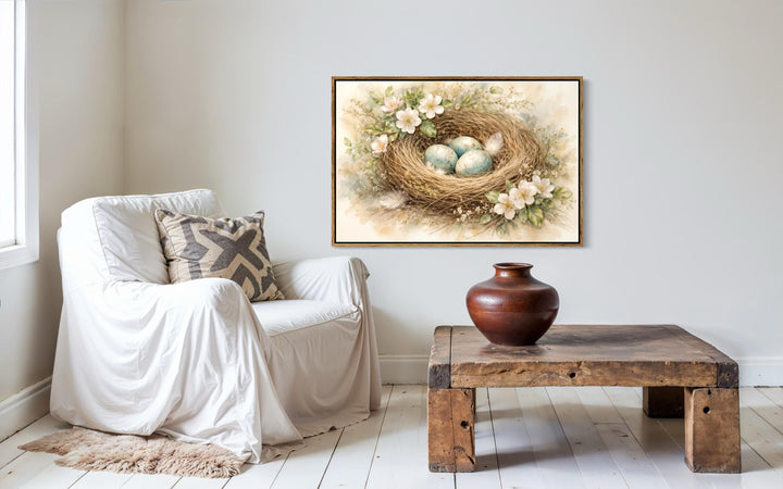 Bird nest wall art featuring blue eggs and spring florals in a rustic living room setting.