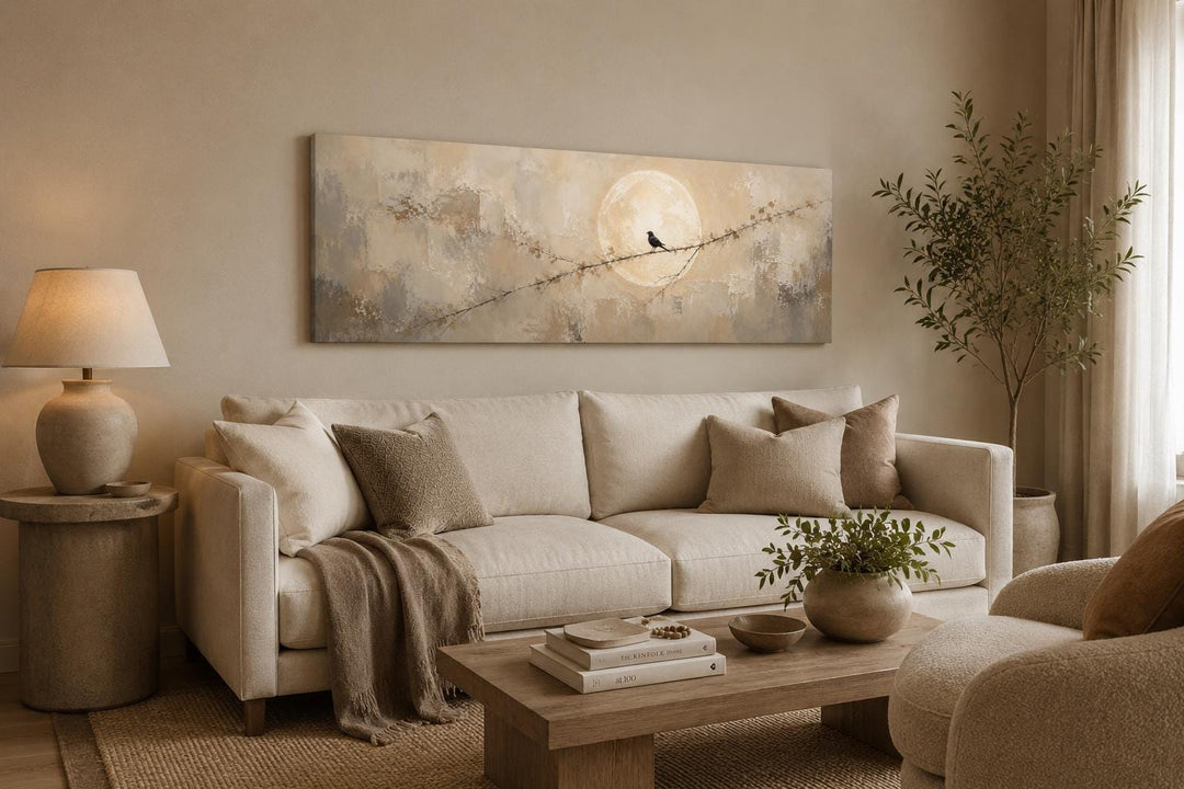 Bird on Branch Silhouette With Moon Neutral Beige Abstract Above Bed Canvas Print in a living room.