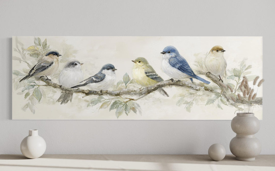 Panoramic canvas print featuring a row of six colorful birds perched on a branch in neutral tones.