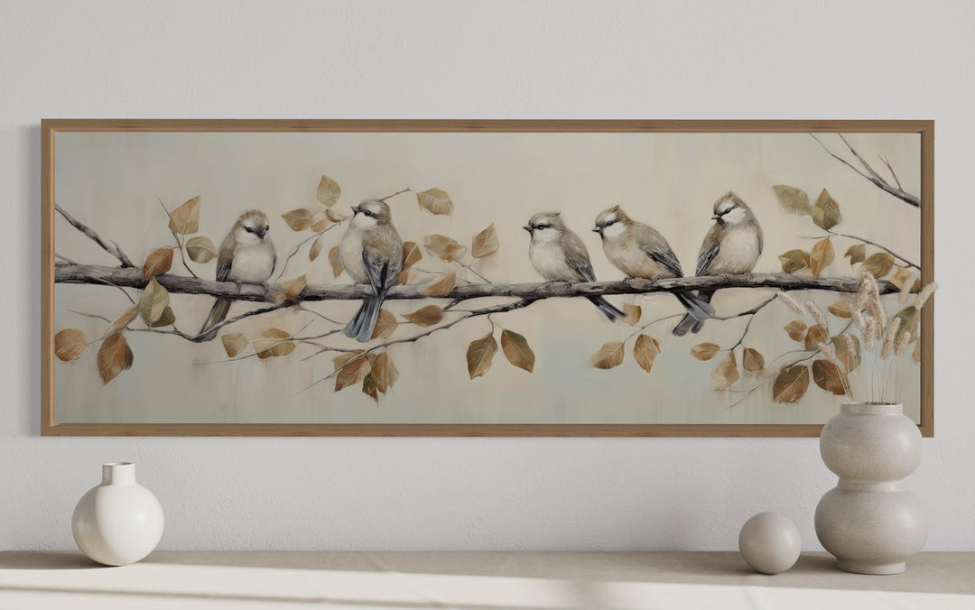 Panoramic painting of five birds on a branch with autumn leaves in a distressed wood frame.