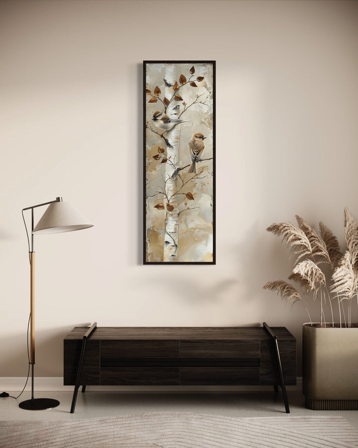 Long narrow vertical wall art of birds on a birch tree.