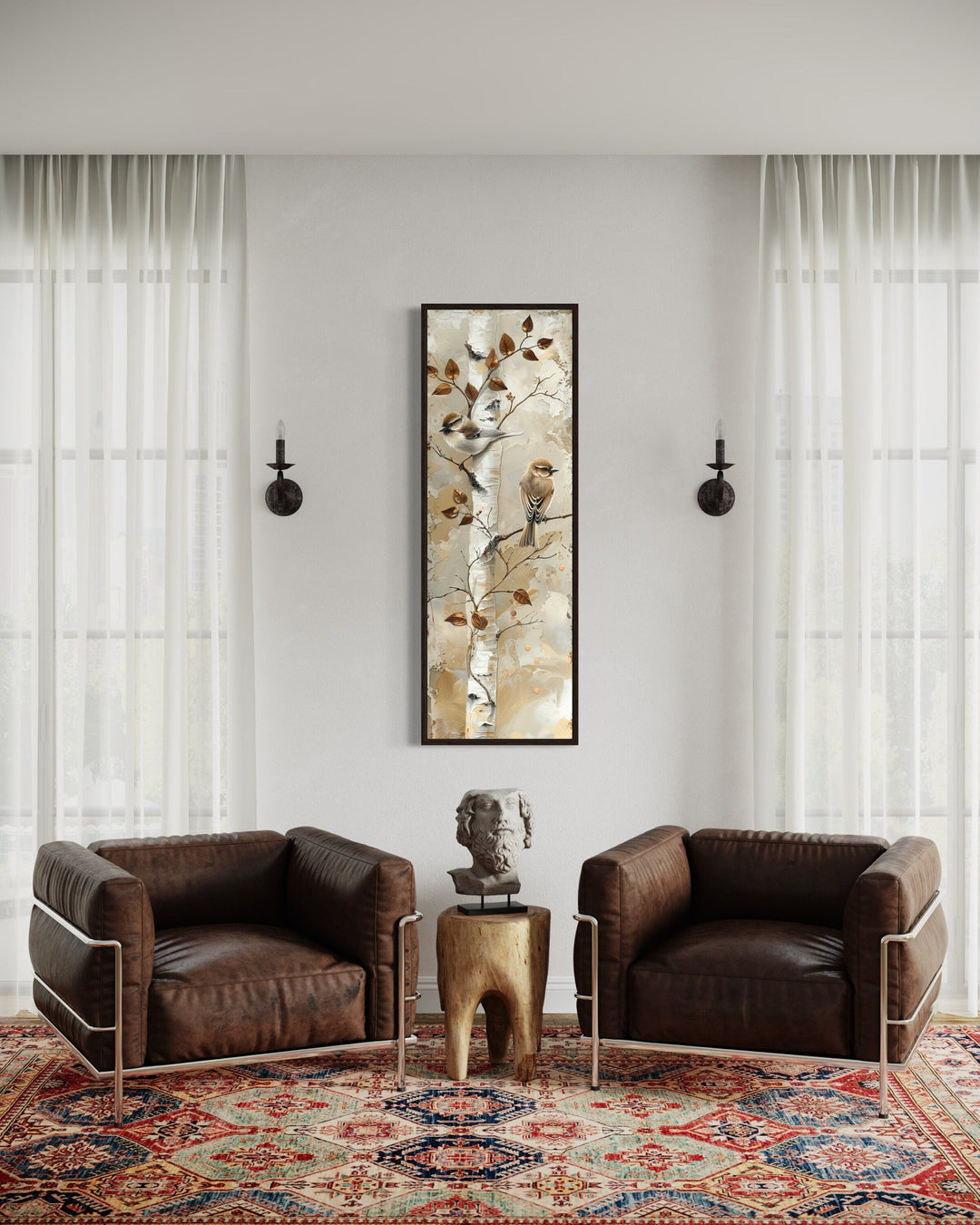 Vertical wall art of birds on a birch tree in a room with leather chairs and a patterned rug.