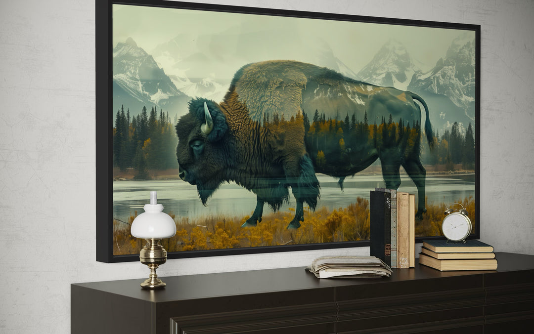 Bison and Yellowstone double exposure canvas wall art in a black frame above a dark wood dresser.