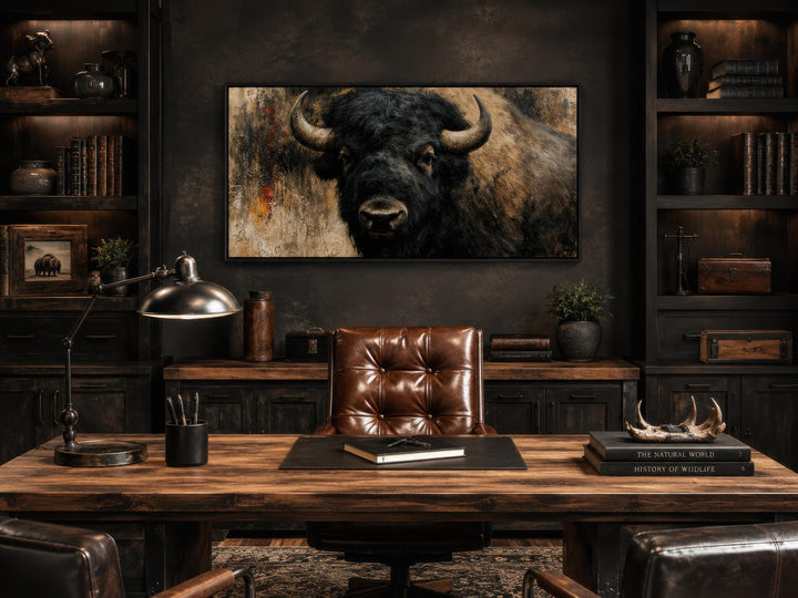 Large American bison canvas print centered in a rustic, dark-toned office with leather furniture.