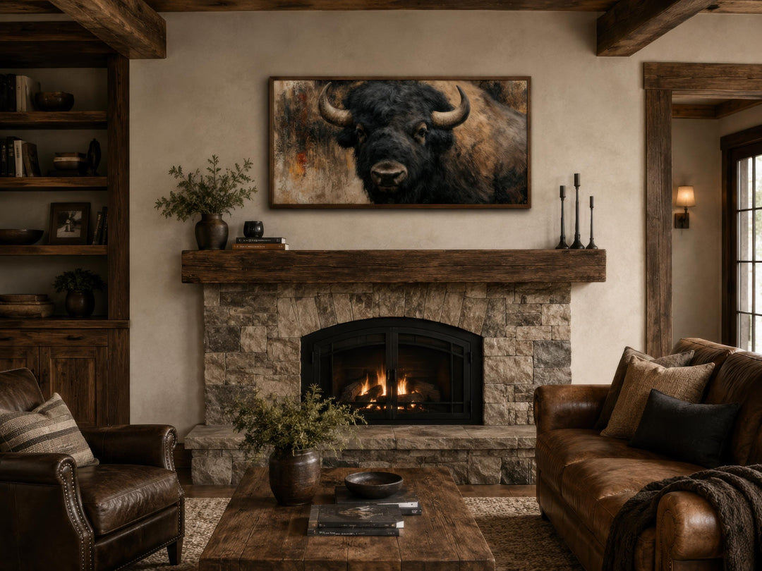 Large horizontal canvas print of a detailed American bison portrait above a rustic stone fireplace.
