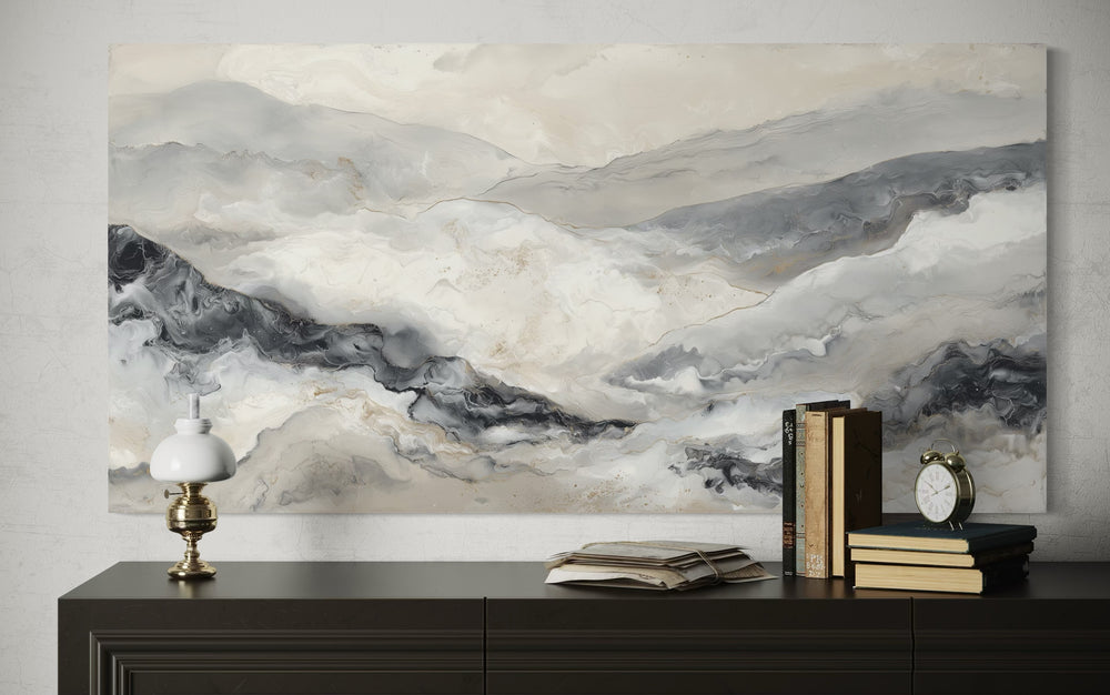 Black and white abstract marble mountains canvas wall art displayed above a dark wooden sideboard.