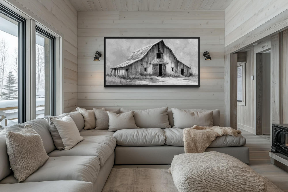 Black and white rustic barn canvas print hanging in a modern farmhouse living room.