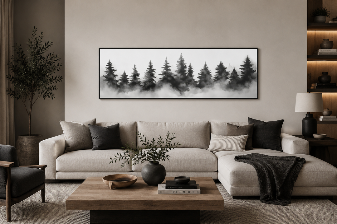 Black and white watercolor foggy pine tree forest horizontal canvas wall art above a sofa.