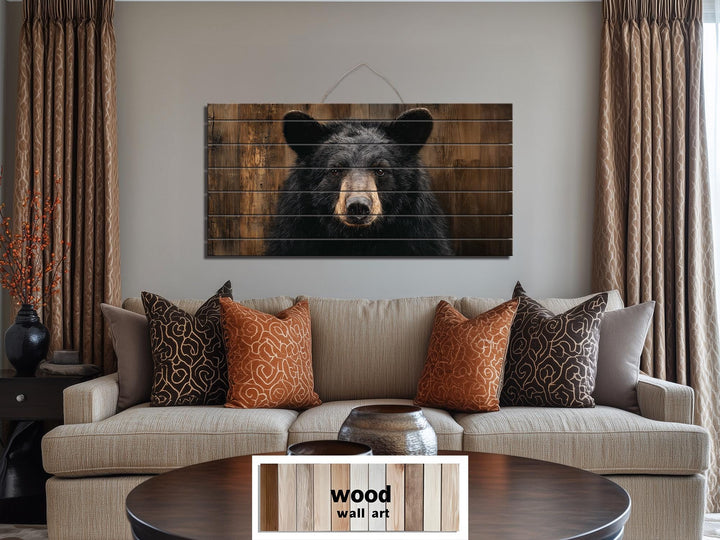 Large horizontal wood wall art featuring a realistic black bear portrait on rustic timber planks.