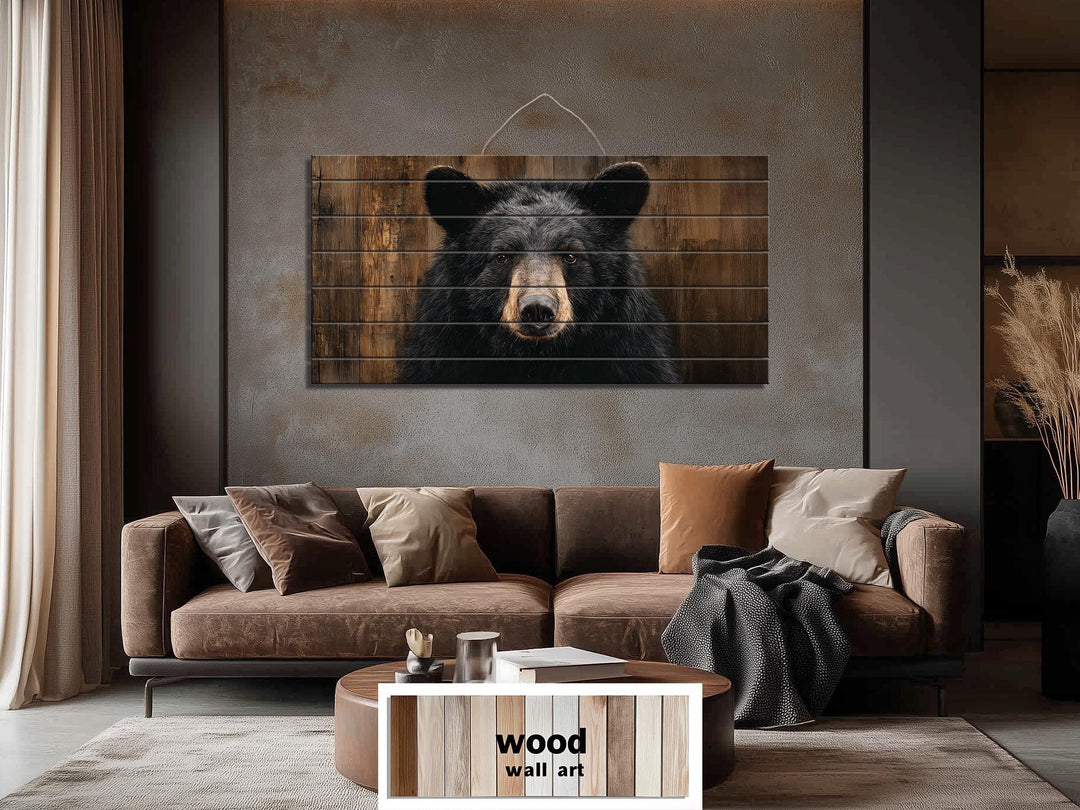 Large horizontal wood wall art featuring a realistic black bear portrait on rustic timber planks.