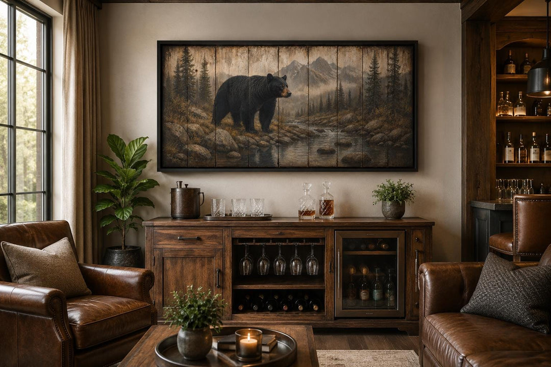 Rustic black bear canvas wall art above a wooden bar cabinet in a mountain lodge setting.