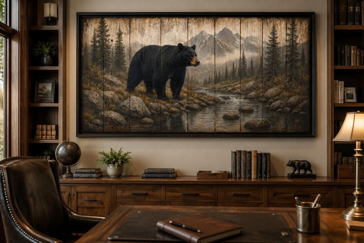Rustic black bear canvas wall art in a mountain forest scene, hanging in a wood-paneled office.