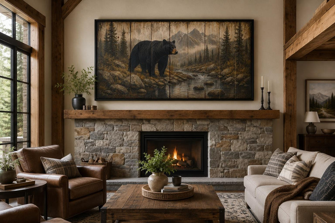 Black bear wall art canvas print above a stone fireplace in a rustic mountain lodge living room.