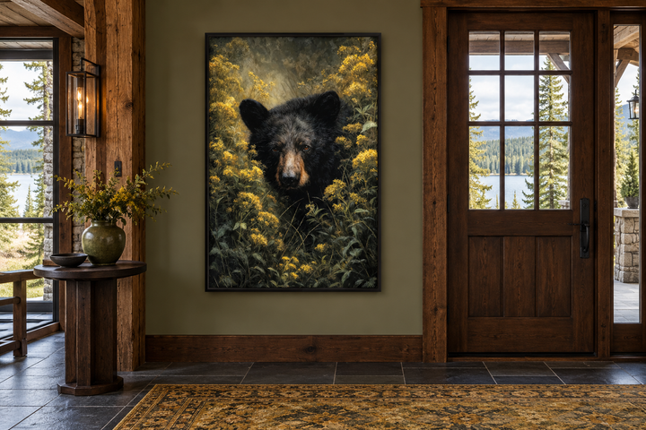 Black Bear in Yellow Wildflowers framed canvas wall art in a rustic cabin entryway.