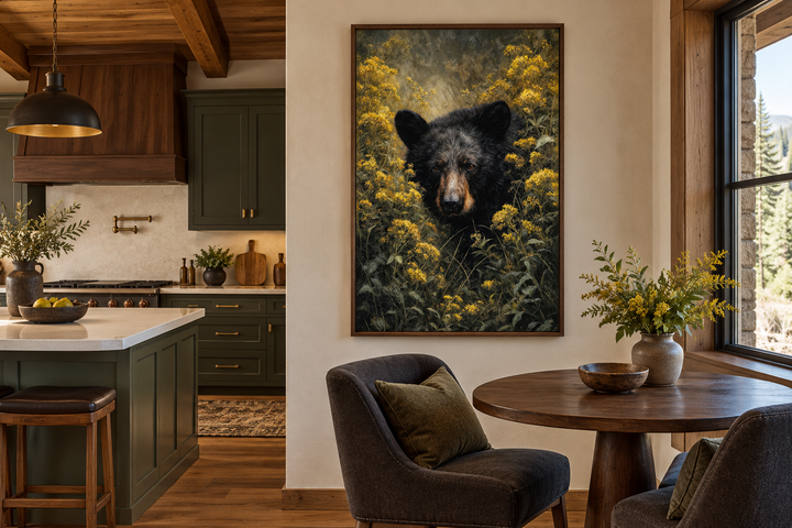 Black bear in yellow wildflowers framed canvas wall art in a rustic kitchen and dining area.