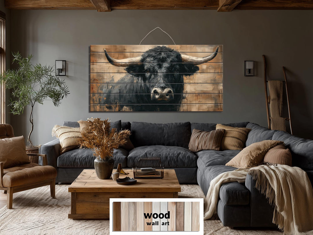 Large horizontal wood wall art featuring a rustic black bull portrait in a cozy living room.