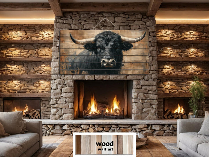 Large horizontal wood wall art featuring a rustic black bull portrait above a stone fireplace.