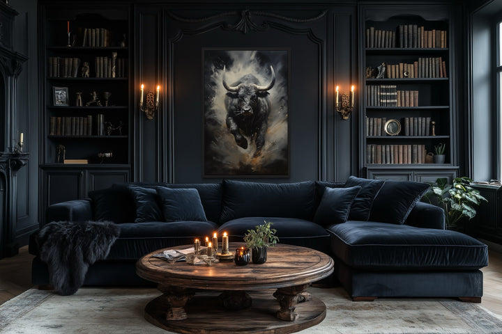 Framed canvas wall art of a charging black bull in a dark, sophisticated office or living room.